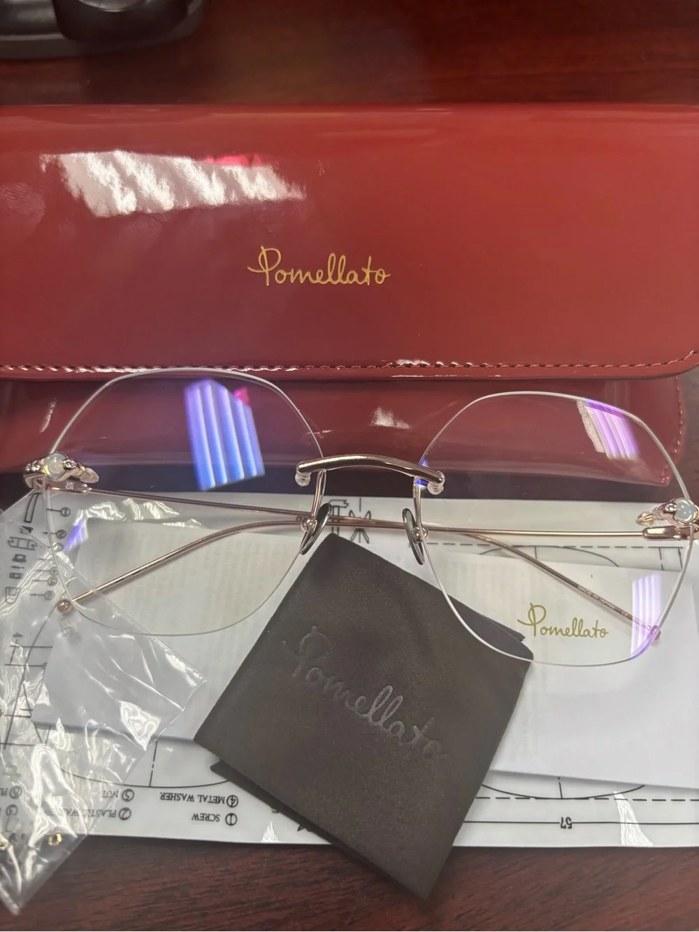 Pomellato Gold Rimless Glasses with Red Case